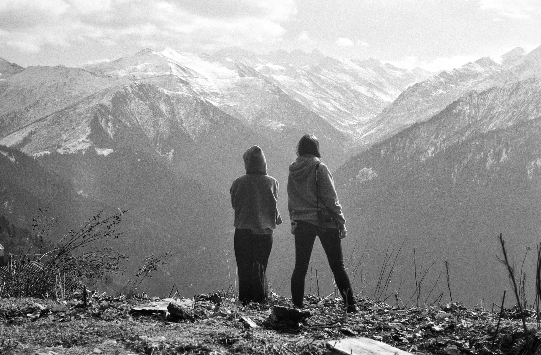 Travelers gazing over coastal cliffs