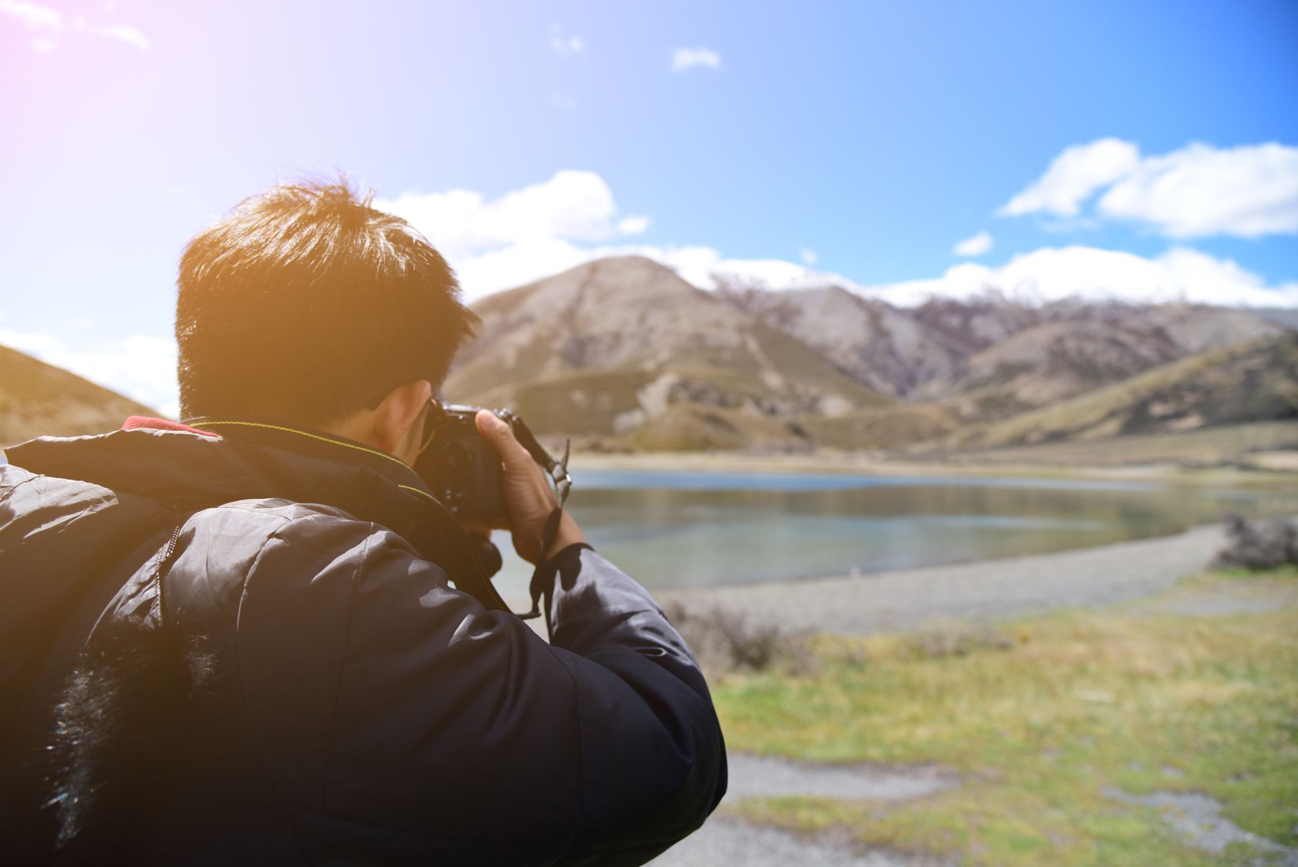 Travel photographer in natural landscape